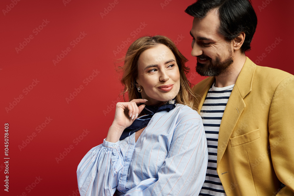 A middle aged couple shares a light hearted interaction, exuding charm and warmth. A middle aged couple shares a light hearted interaction, exuding charm and warmth.
