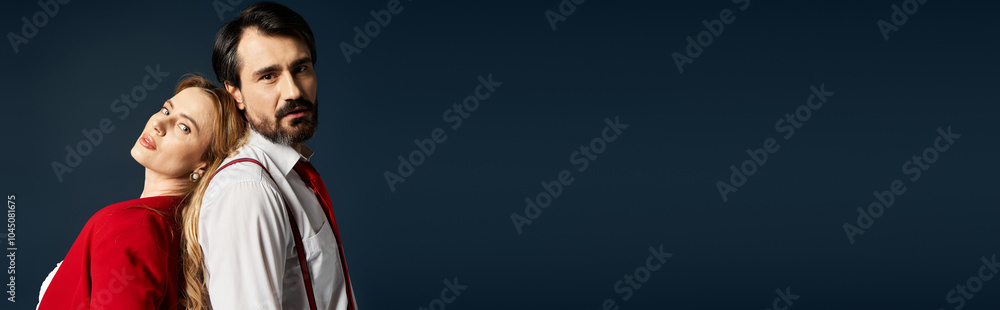 A middle aged couple stands back to back, embodying emotion in a captivating, artistic portrait. A middle aged couple stands back to back, embodying emotion in a captivating, artistic portrait.