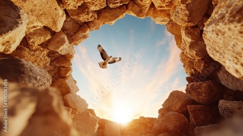 A bird captured in upward flight framed by a rustic stone circle, dramatically set against a blue sky, portraying freedom and uplifting journeys. photo