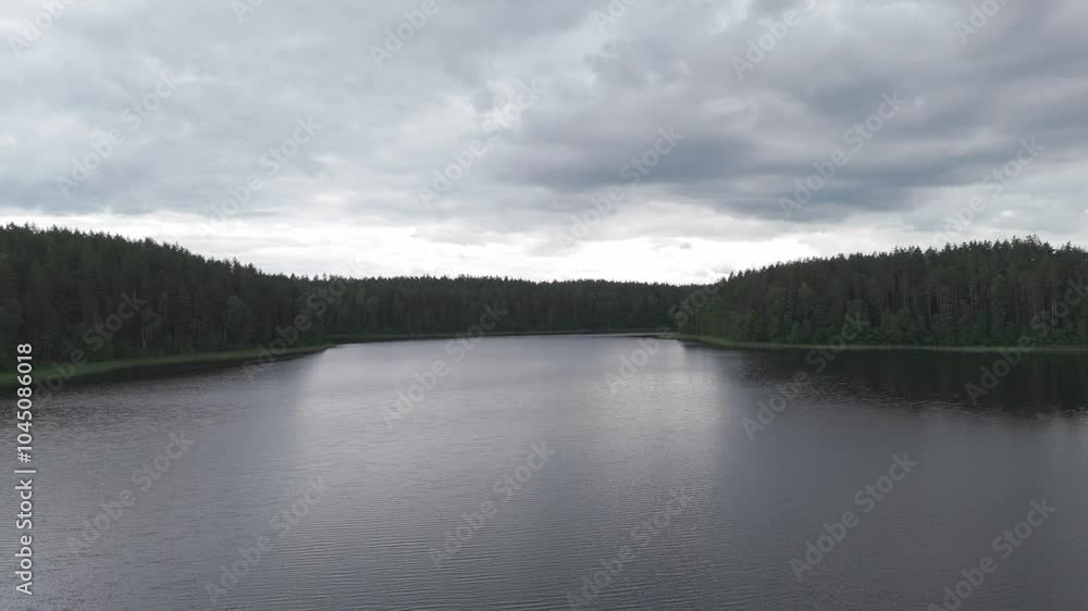 Landcape of lake and forest around with cloudy sky Landcape of lake and forest around with cloudy sky