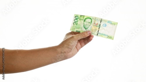 Wallpaper Mural Hand holding a 200 peso philippine banknote over an isolated white background, showcasing the filipino currency. Torontodigital.ca