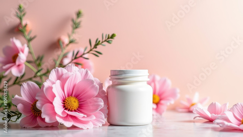 White pill bottle with a blank label surrounded by pink flowers and greenery, set against a soft pink background. Ideal for supplements, vitamins, or pharmaceutical product mockups.