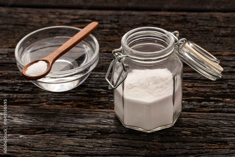 Glass jar with baking soda to mix with water - Healthy food. Glass jar with baking soda to mix with water - Healthy food.