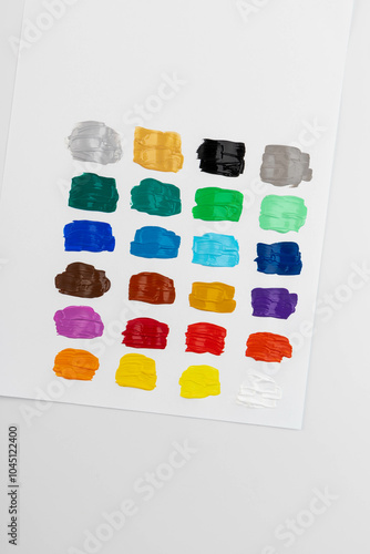 Set with strokes of colorful oil paints on white background, top view