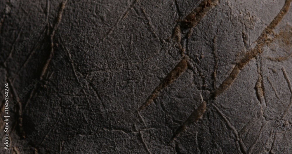 Close-up of Dark Grey Cracked Stone Surface Close-up of Dark Grey Cracked Stone Surface
