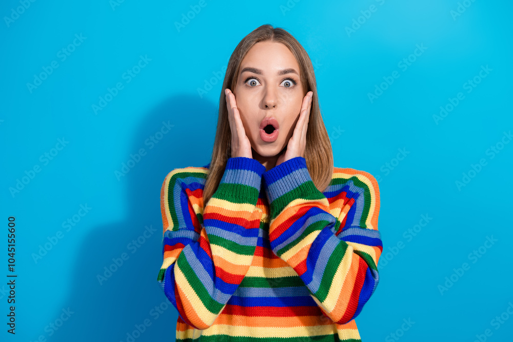 Photo of lovely adorable girl open mouth wear stylish striped colorful clothes sale isolated on blue background Photo of lovely adorable girl open mouth wear stylish striped colorful clothes sale isolated on blue background