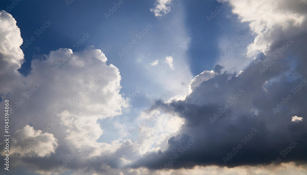 Obraz premium Sunbeams through Cloudy Sky