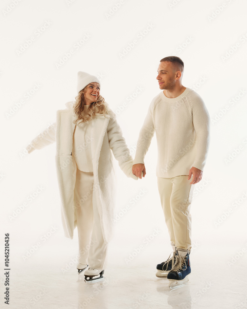 Family holds hands, embracing joy of winter, celebrating together on ice during holiday season against white studio background. Concept of winter time, New Year holidays, Christmas vacation. Ad Family holds hands, embracing joy of winter, celebrating together on ice during holiday season against white studio background. Concept of winter time, New Year holidays, Christmas vacation. Ad