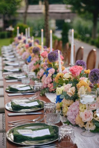 Outdoor Wedding Reception with Floral Centerpieces and Elegant Table Setting - A Romantic Garden Event
