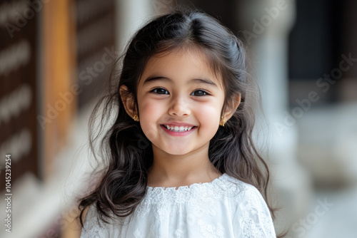 Indian little girl in traditional hanbok costume at korean village palace