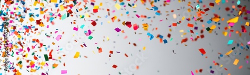 Brightly colored confetti falling from the sky on a gray background