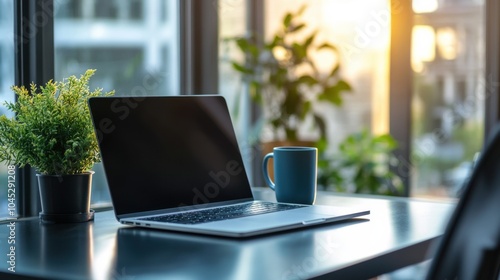 High-quality shot of a sleek modern office setup, with a laptop, coffee cup, and plant on a clean desk, surrounded by natural light.