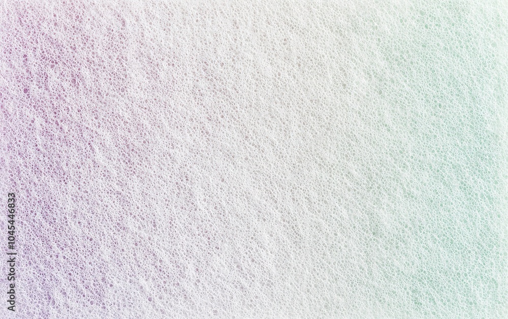 Obraz premium Soft pastel foam texture displaying subtle colors in a gradient pattern, creating a smooth and calming visual effect