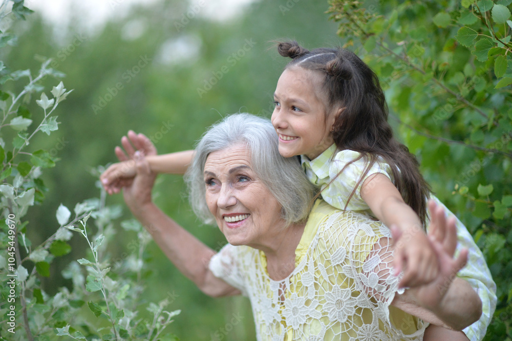 Portrait of a little girl with her grandmother in nature Portrait of a little girl with her grandmother in nature