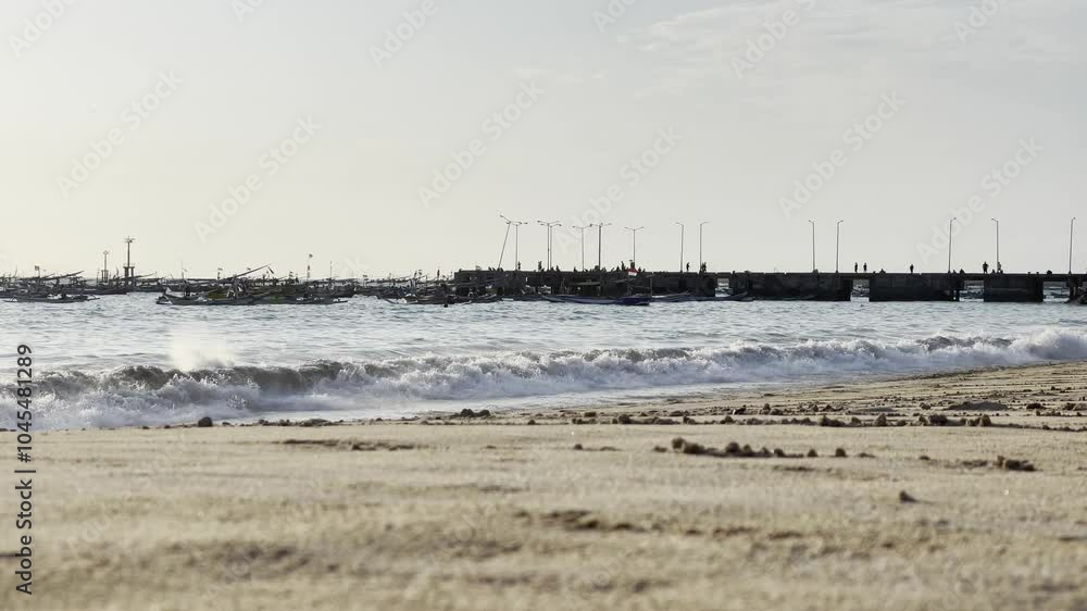Beach at Almost Sunset – Serene video of a beach with the sun setting, casting golden hues over the waves and sky Beach at Almost Sunset – Serene video of a beach with the sun setting, casting golden hues over the waves and sky