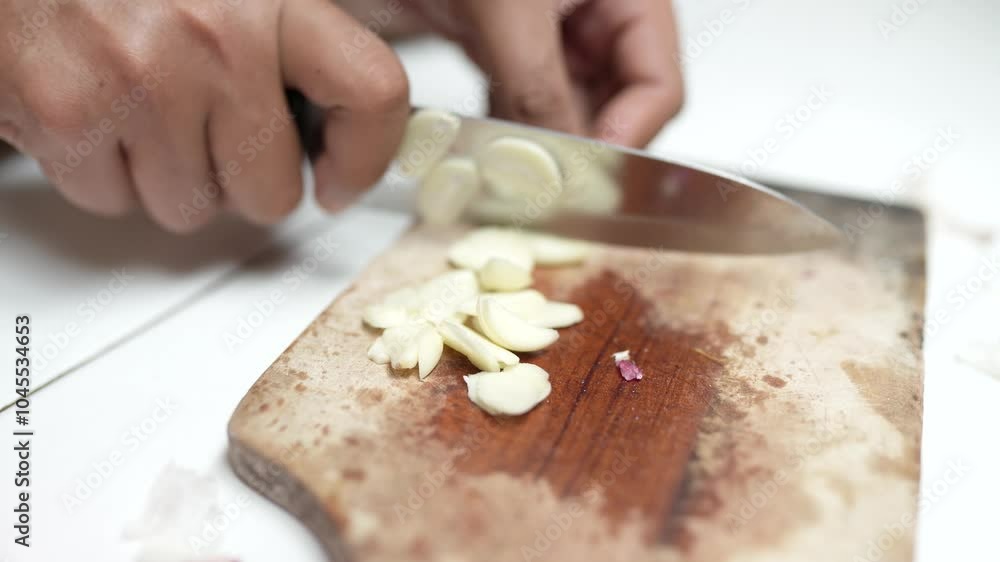 A close-up of freshly chopped garlic and red onions on a cutting board, showcasing the vibrant colors and texture, perfect for cooking or food preparation themes. A close-up of freshly chopped garlic and red onions on a cutting board, showcasing the vibrant colors and texture, perfect for cooking or food preparation themes.