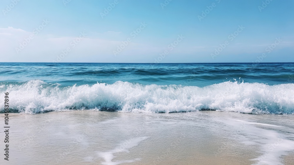 Ocean waves rolling in and crashing on a sandy shore, with clear blue skies and a calm, tranquil atmosphere Ocean waves rolling in and crashing on a sandy shore, with clear blue skies and a calm, tranquil atmosphere