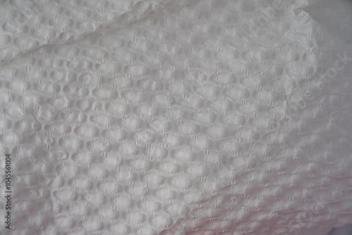 Recycled perforated white paper close up texture. Old paper background.