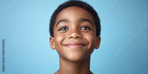 Black teenager boy on a studio background