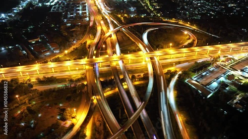 Expressway top view, Road traffic an important infrastructure, Drone aerial view fly in circle, traffic transportation, Public transport or commuter city life concept of economic and energ, transport.