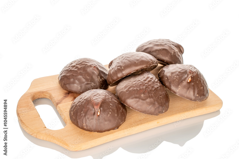 Marshmallow in chocolate on a wooden tray, macro, isolated on white background. Marshmallow in chocolate on a wooden tray, macro, isolated on white background.