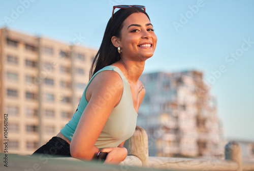 Smile, summer and travel with portrait of woman in city for relax, vacation and sunset in Miami. Happiness, calm and adventure with person in outdoor promenade for holiday, tourism and peace trip #1045601612