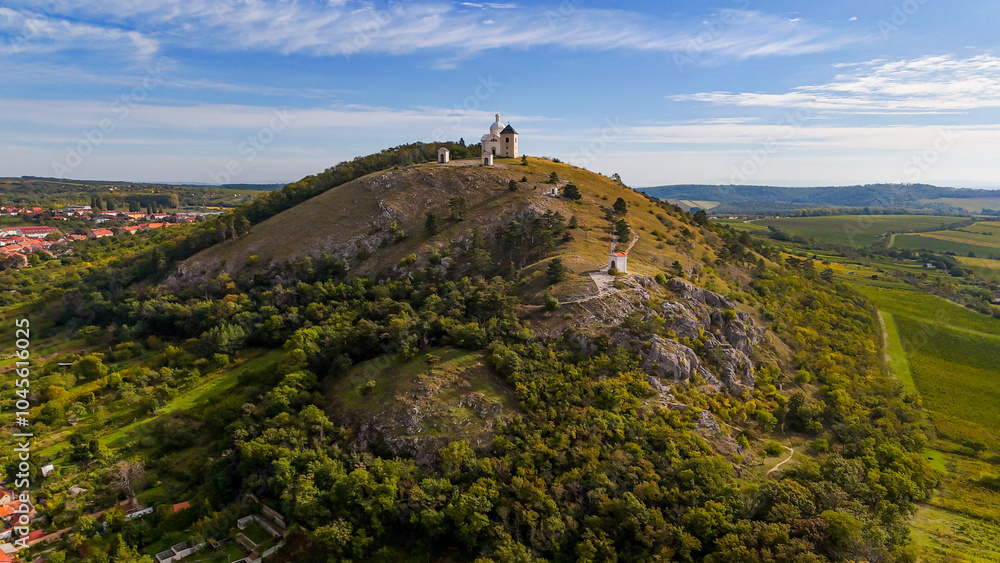 Mikulov Castle in the town of Mikulov in South Moravia, Czech Republic. Aerial View of Old Town Castle and Powder Tower in Mikulov, Czech Republic, Europe. Famous landmark in South Moravia wine region Mikulov Castle in the town of Mikulov in South Moravia, Czech Republic. Aerial View of Old Town Castle and Powder Tower in Mikulov, Czech Republic, Europe. Famous landmark in South Moravia wine region