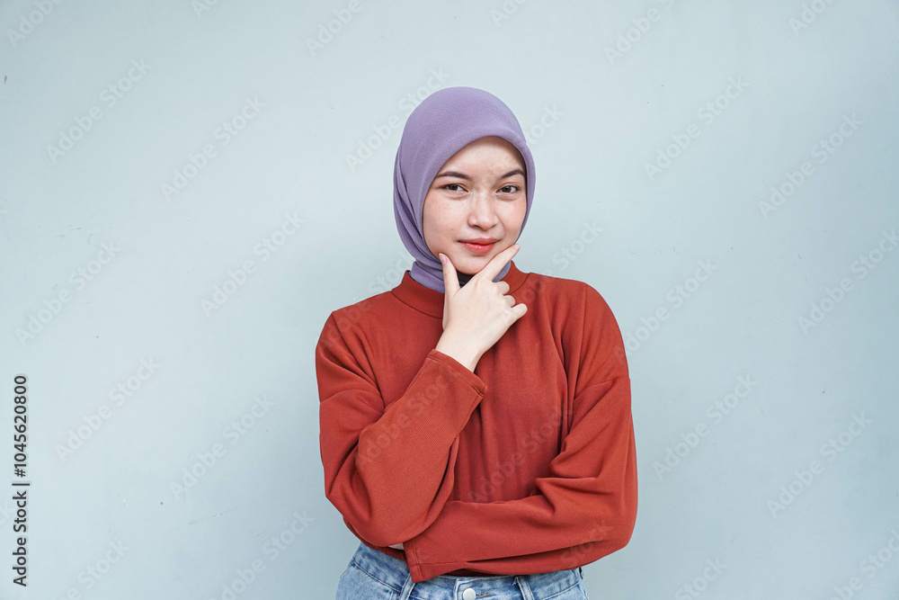 Pensive beautiful Asian woman in red sweater thinking about something and looking away isolated over white background. Pensive beautiful Asian woman in red sweater thinking about something and looking away isolated over white background.