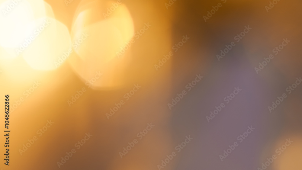 Golden bokeh festive background with soft, twinkling lights and a glowing effect