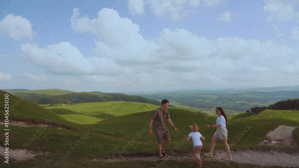 The family is walking, the child is walking with his parents, the girl is walking with her parents The family is walking, the child is walking with his parents, the girl is walking with her parents