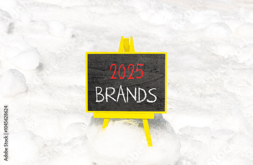 Planning 2025 brands new year symbol. Concept words 2025 Brands on beautiful yellow chalk blackboard. Beautiful white snow background. Business 2025 brands new year concept. Copy space.