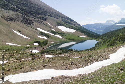 ptarmigan lake on the trail to Ptarmigan Tunnel at the Glacier national park, Montana, USA. photo