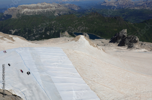 protective tarp covers the snow on the Marmolada glacier in northern Italy to protect the ice from the summer heat photo