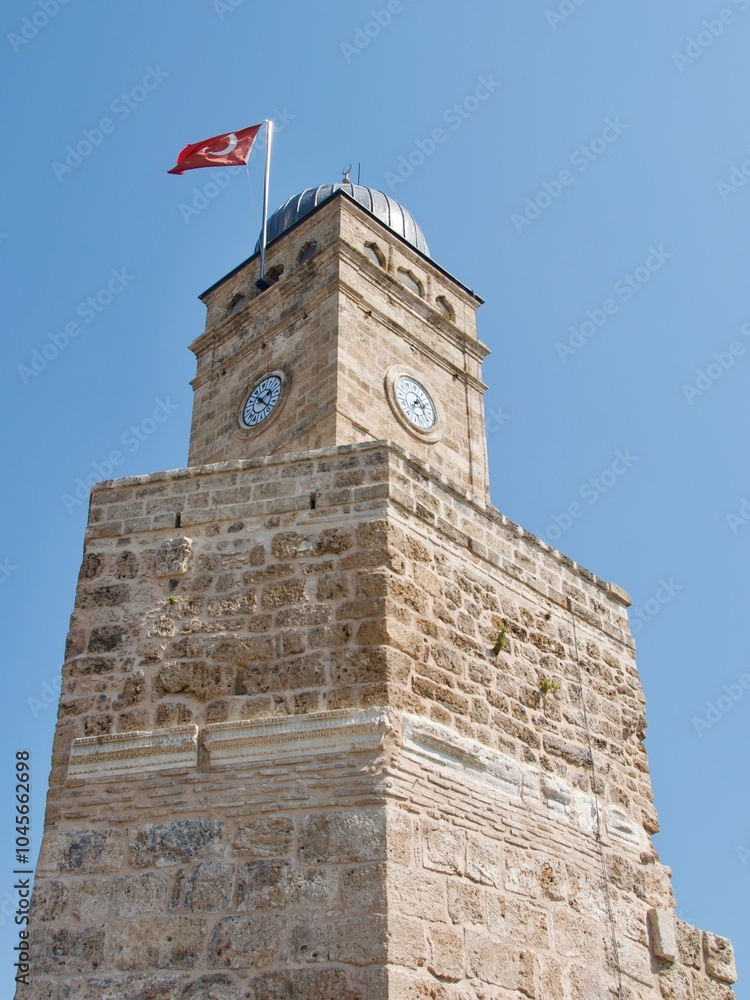 An ancient clock tower in the old town of Antalya, Turkey
