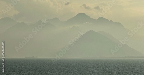 Obraz na płótnie Far away view of Taurus Mountains on the horizon of the Mediterranean Sea in Turkey w salonie