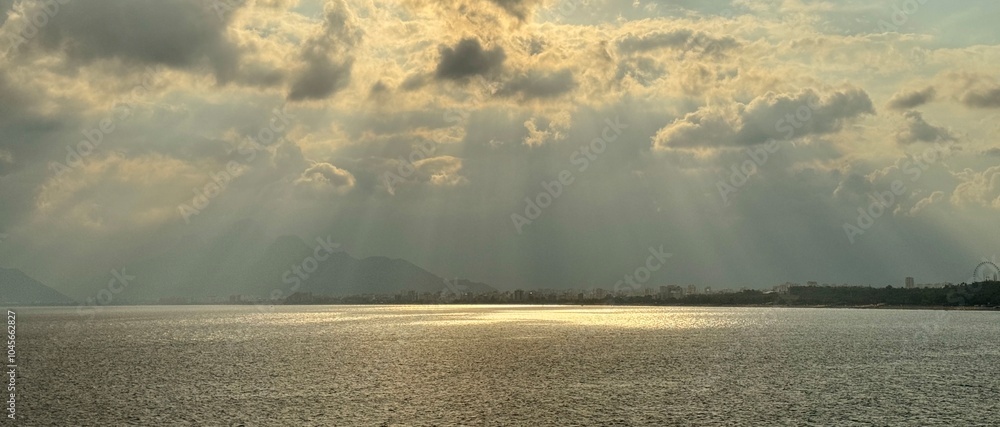 Beautiful sky with sun rays shining on the Mediterranean Sea in Antalya, Turkey