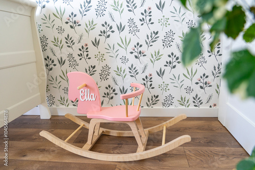 hobbyhorse in a nursery baby room with wallpaper