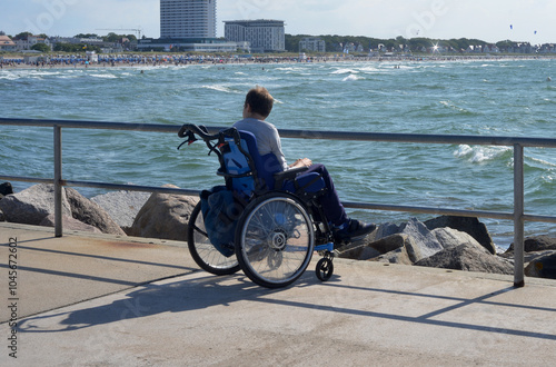 Wallpaper Mural A disabled person in a wheelchair watching the baltic sea and the beach in Rostock Warnemuende Torontodigital.ca