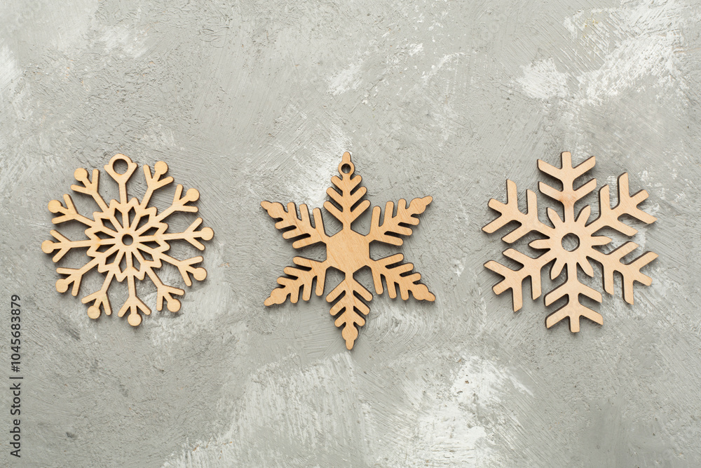 Beautiful snowflake on concrete background, top view Beautiful snowflake on concrete background, top view