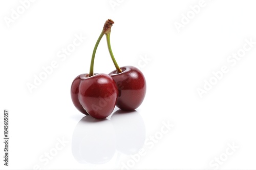 Close-up: Three Fresh Montmorency Cherries with Stems on White photo