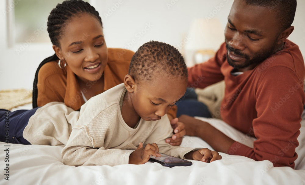 Happy, phone and African parents with child on bed for bonding, relax together and relationship in home. Family, love and mom, dad and boy on smartphone in bedroom for playing, online videos and fun Happy, phone and African parents with child on bed for bonding, relax together and relationship in home. Family, love and mom, dad and boy on smartphone in bedroom for playing, online videos and fun