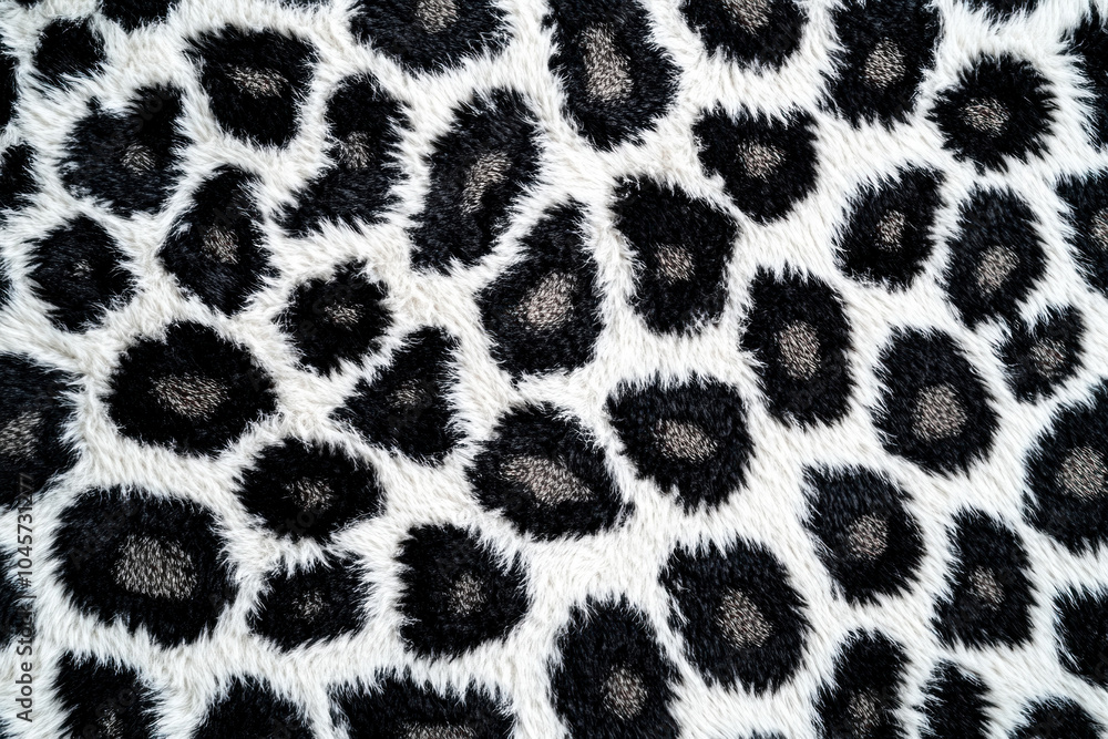 Black and white animal print fabric draped elegantly, creating a bold and stylish statement. Black and white animal print fabric draped elegantly, creating a bold and stylish statement.