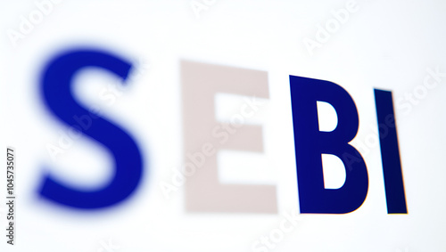 A closeup picture of letters SEBI representing Securities and exchange board of India. i photo