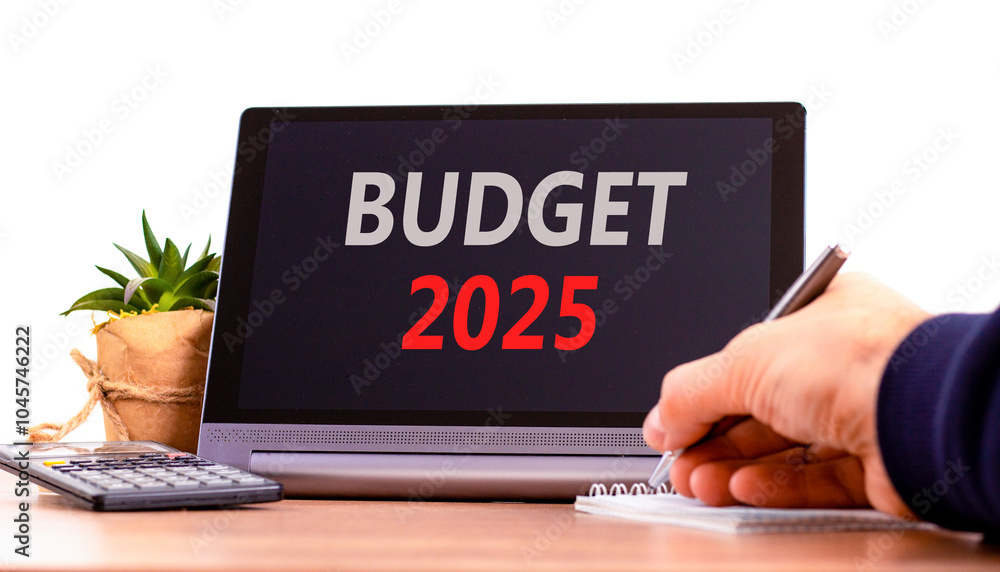 Planning budget 2025 new year symbol. Concept words Budget 2025 on beautiful black tablet. Beautiful white background. Businessman hand. Business budget 2025 new year concept. Copy space. Planning budget 2025 new year symbol. Concept words Budget 2025 on beautiful black tablet. Beautiful white background. Businessman hand. Business budget 2025 new year concept. Copy space.
