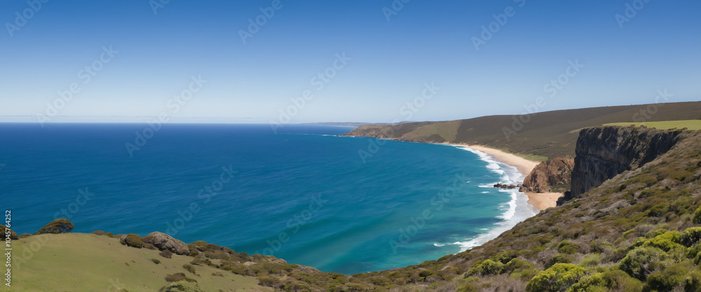 Vast rolling hills of emerald green stretch towards the horizon, meeting the endless blue expanse of the Southern Ocean. Vast rolling hills of emerald green stretch towards the horizon, meeting the endless blue expanse of the Southern Ocean.