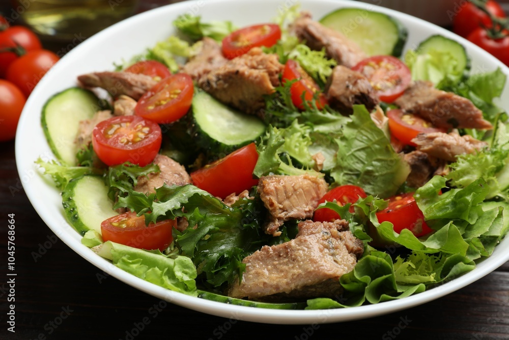 Delicious fresh tuna salad on wooden table, closeup Delicious fresh tuna salad on wooden table, closeup