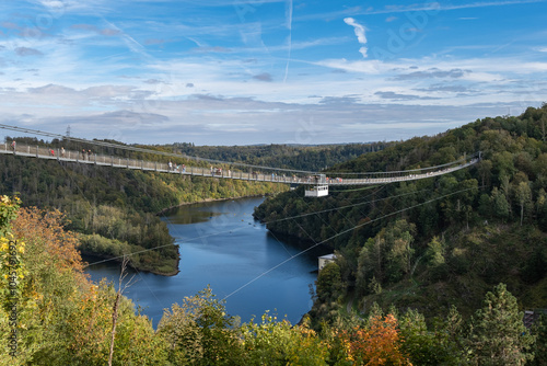 Pedestrian suspension bridge with a length of 483 m above the Rappbode dam Bode river in Harz Mountains National Park, near Thale, Germany photo