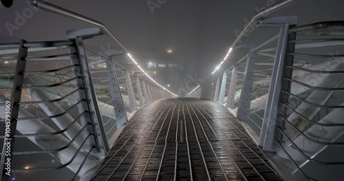 bridge over the river during a foggy winter night