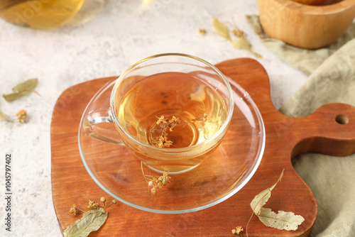Wooden board with cup of ta...