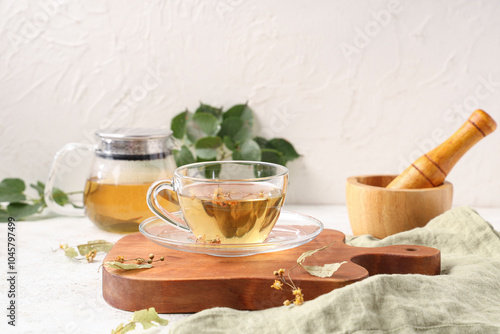 Wooden board with cup of ta...